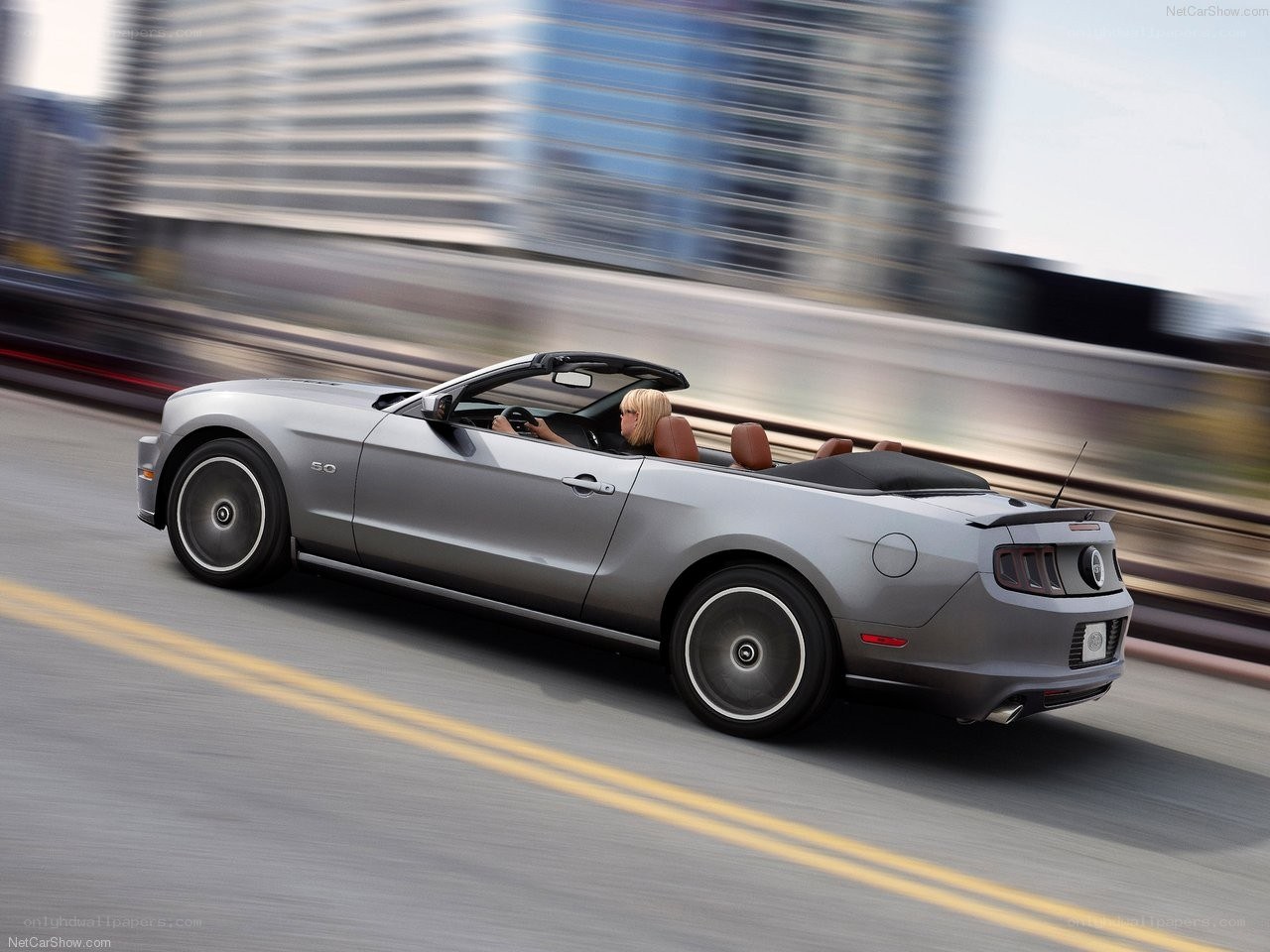 silver mustang convertible in motion