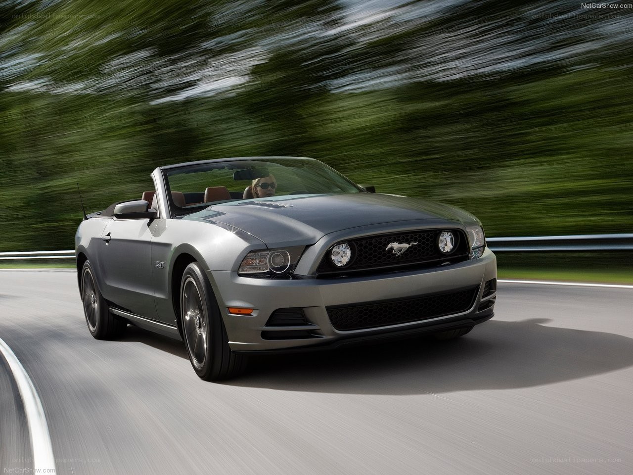 silver mustang convertible in motion