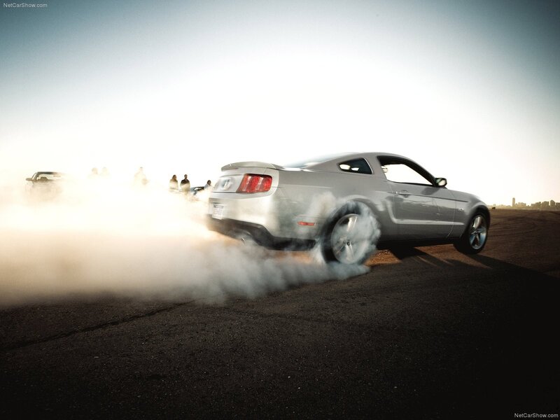 Silver Mustang doing a burnout