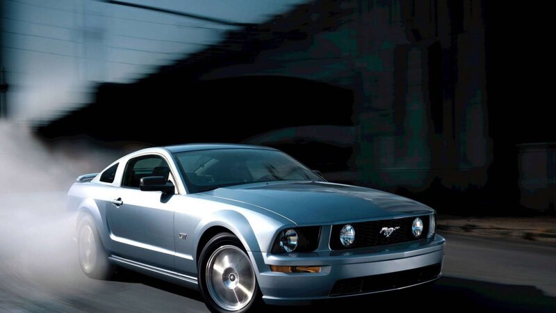 silver mustang in motion