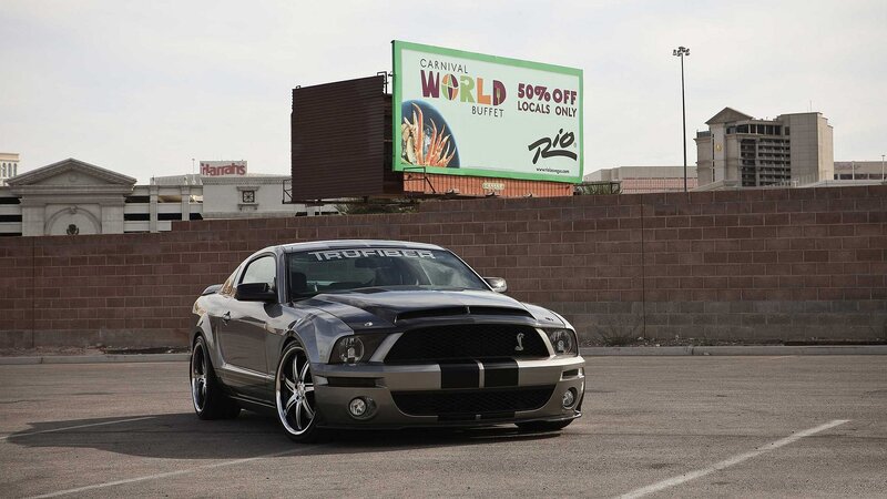 Silver Mustang in parking lot