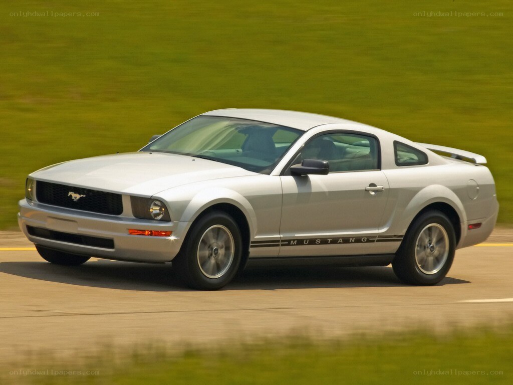 silver mustang on a road