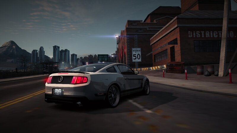 silver mustang on city street