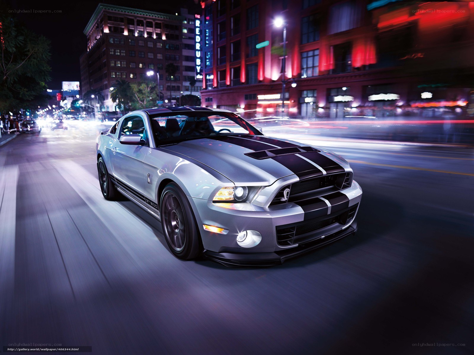 Silver Mustang on city street