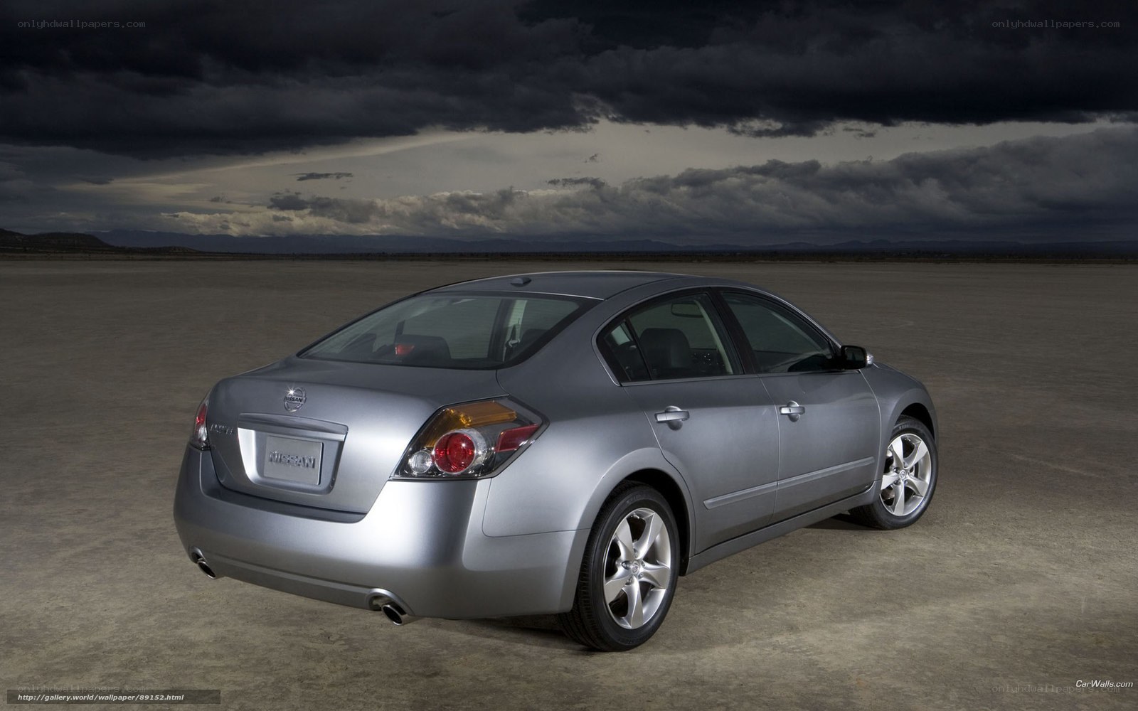 Silver Nissan Altima on desert road