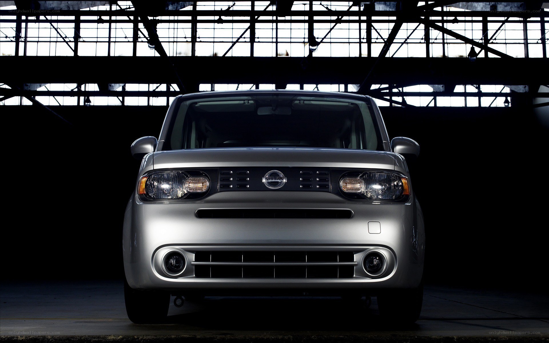 Silver Nissan Cube in a warehouse