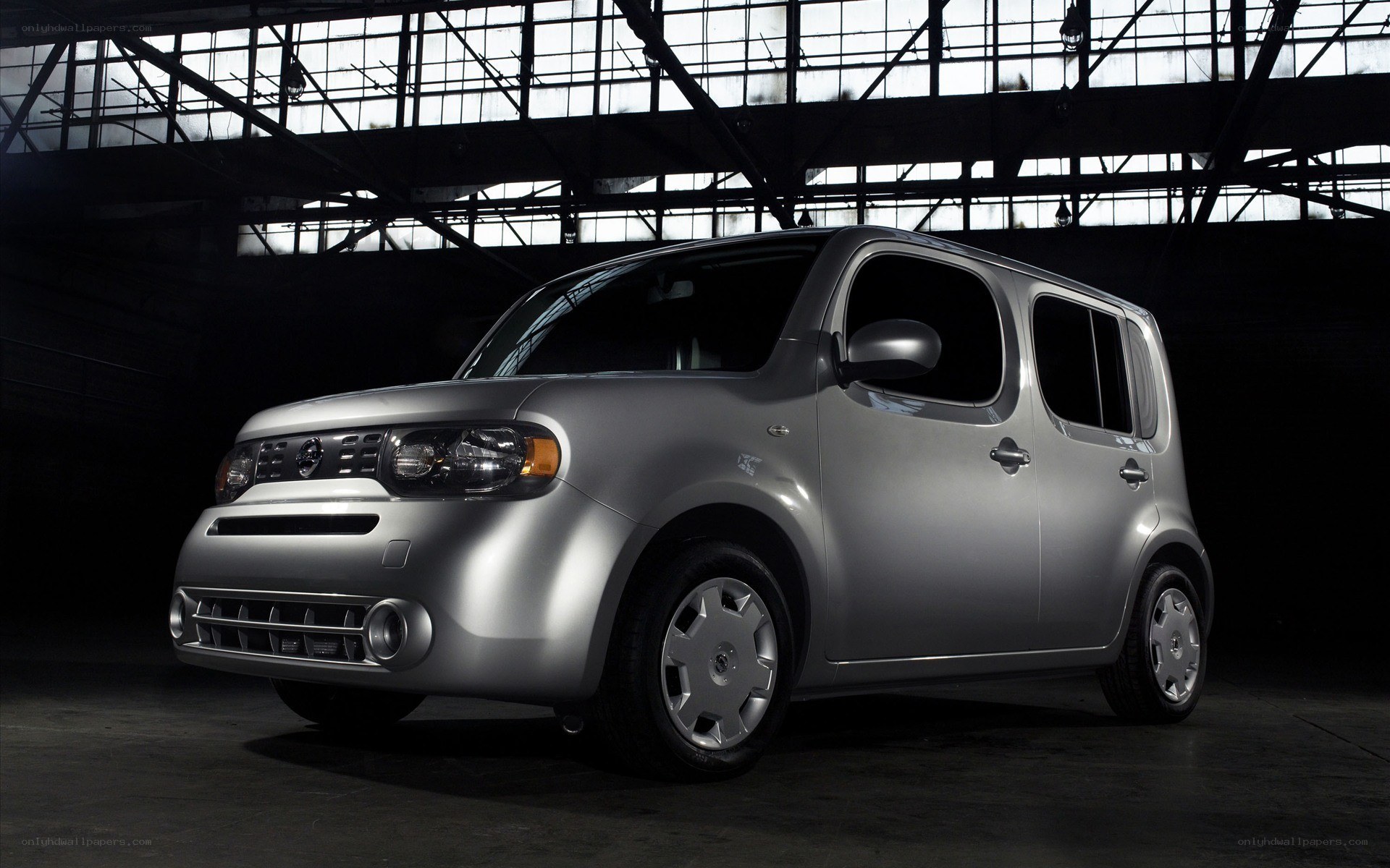 Silver Nissan Cube in warehouse