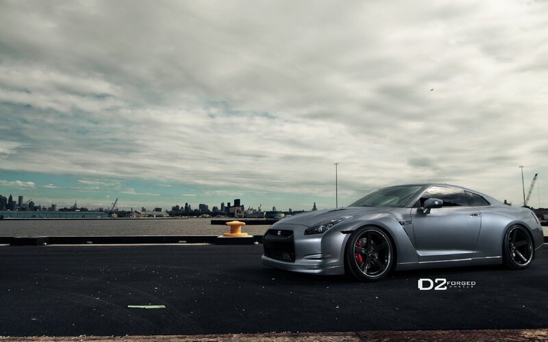 Silver Nissan GT-R on a dock