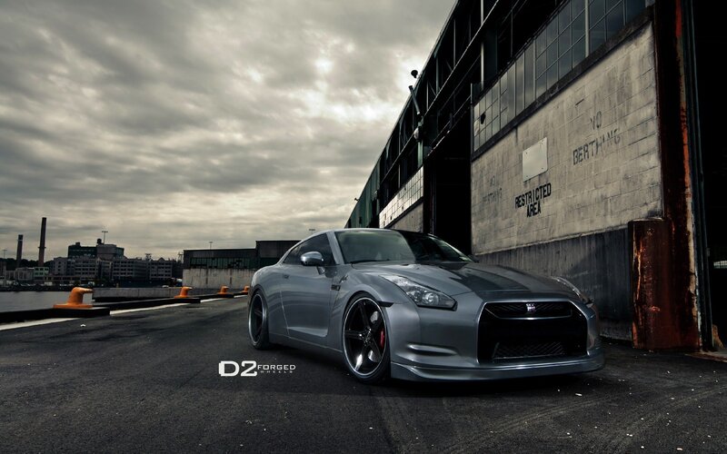 Silver Nissan GT-R on a dock