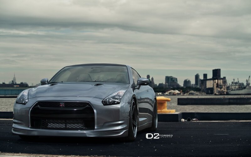 Silver Nissan GT-R on a dock