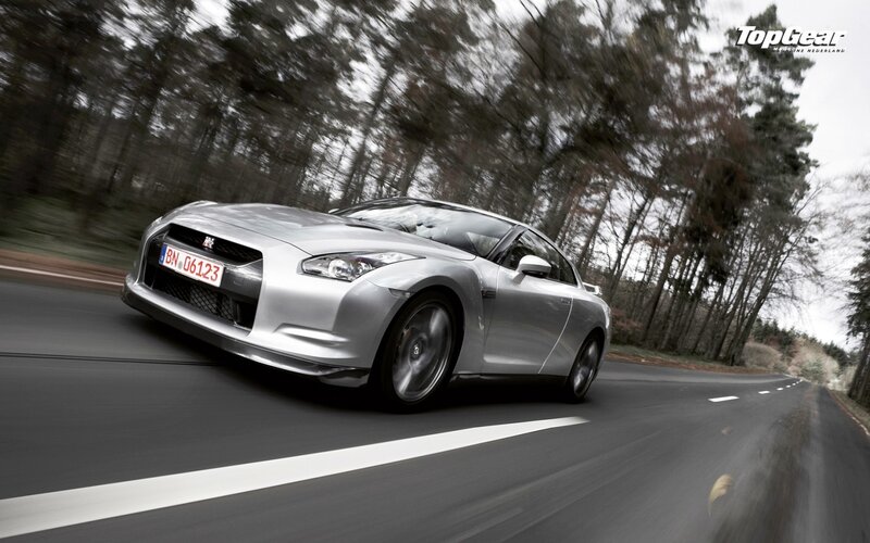 silver nissan gt-r on a forest road