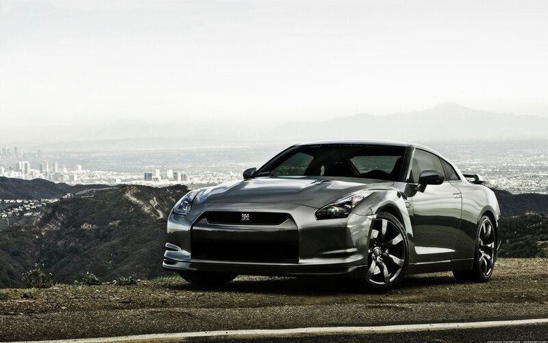 Silver Nissan GT-R on a hillside