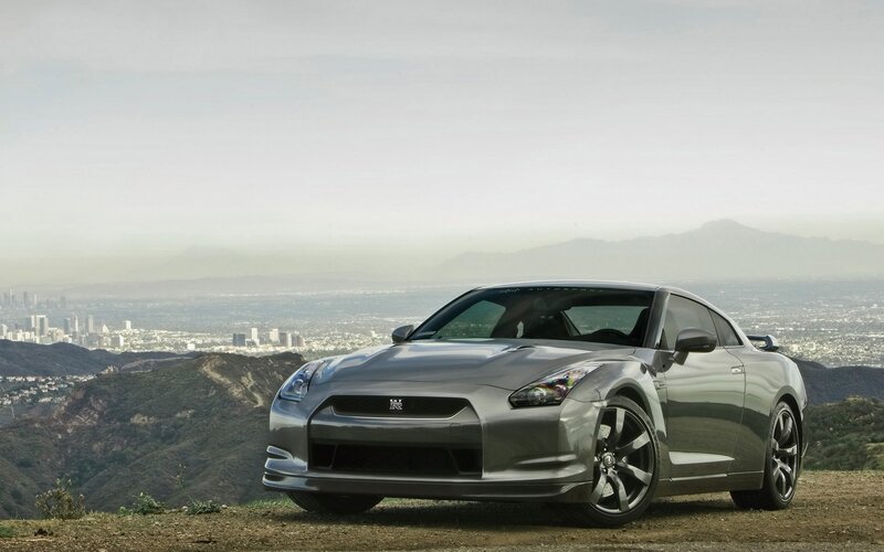Silver Nissan GT-R on a hilltop