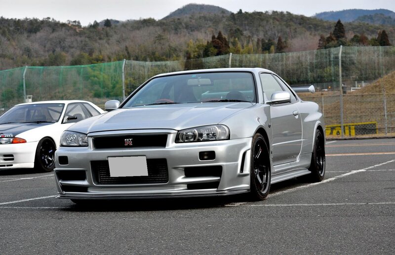 Silver Nissan GT-R on a racetrack