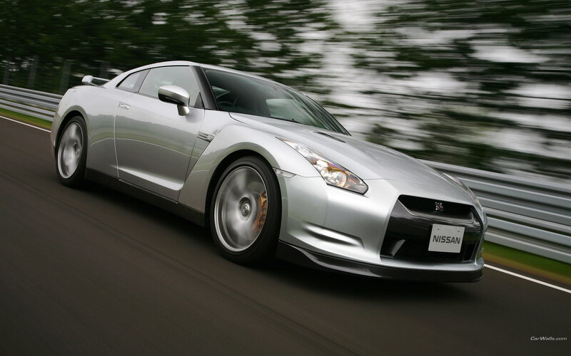 Silver Nissan GT-R on a racetrack
