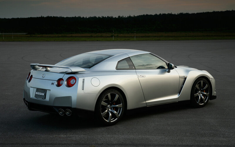 Silver Nissan GT-R on a track
