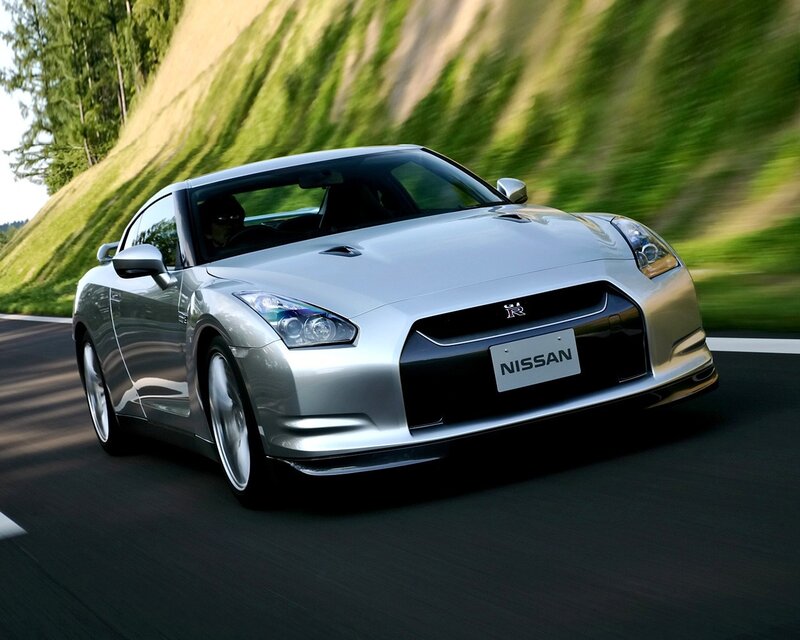 Silver Nissan GT-R on a winding road