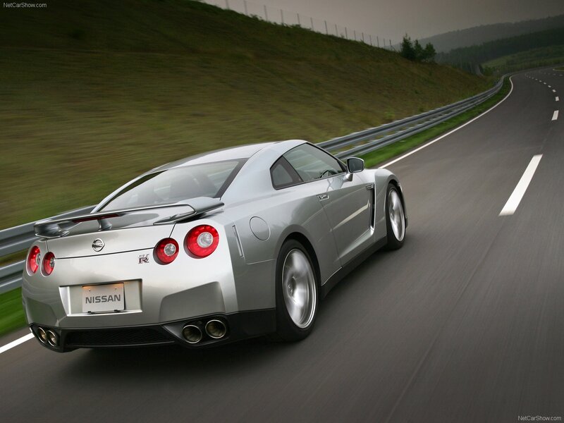 Silver Nissan GT-R on a winding road