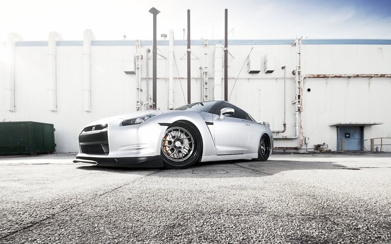 silver nissan gt-r on asphalt