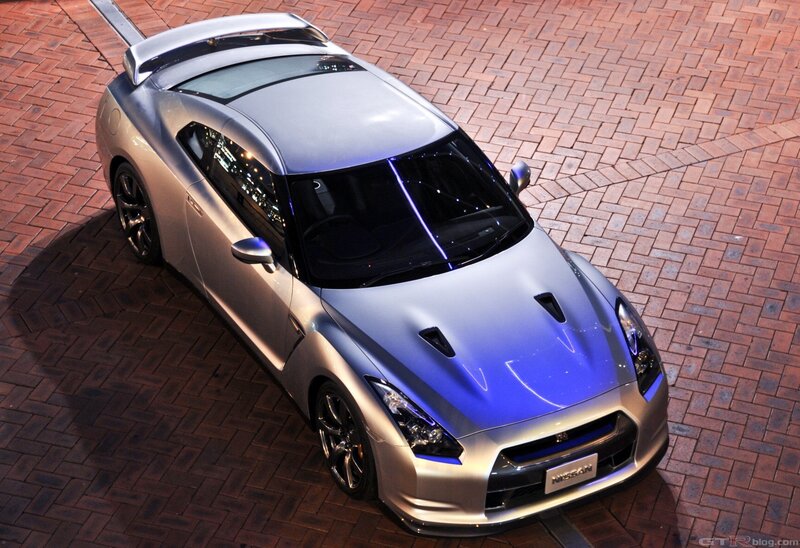 silver nissan gt-r on brick pavement