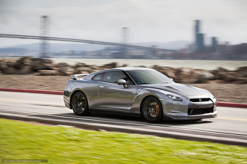 Silver Nissan GT-R on coastal road