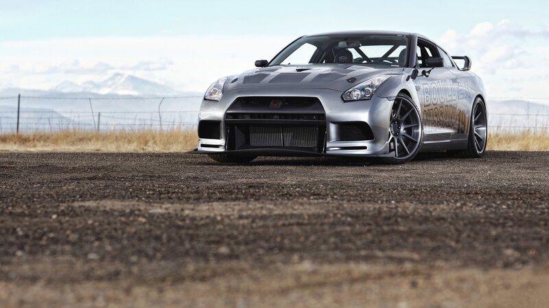 silver nissan gt-r on dirt road