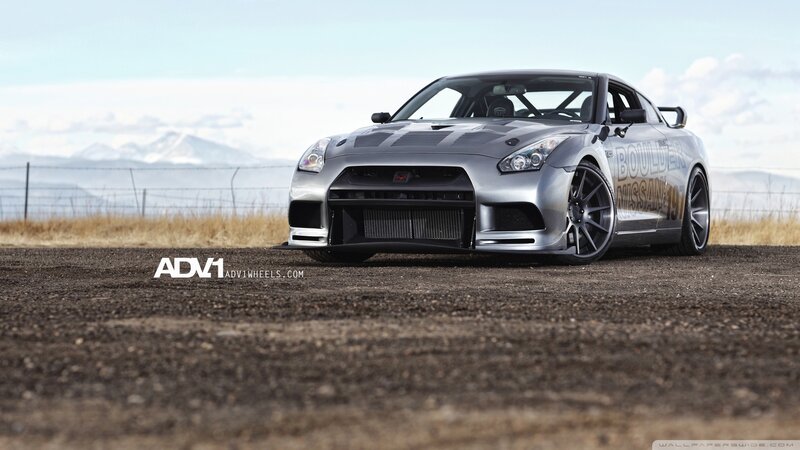 silver nissan gt-r on dirt road