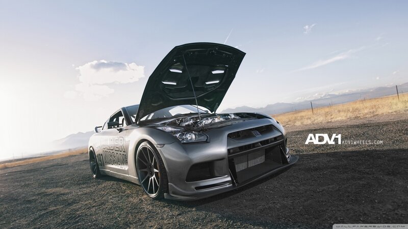 silver nissan gt-r on dirt road