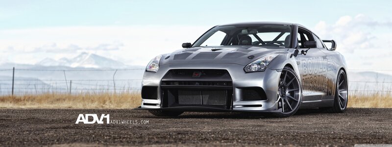 silver nissan gt-r on dirt road