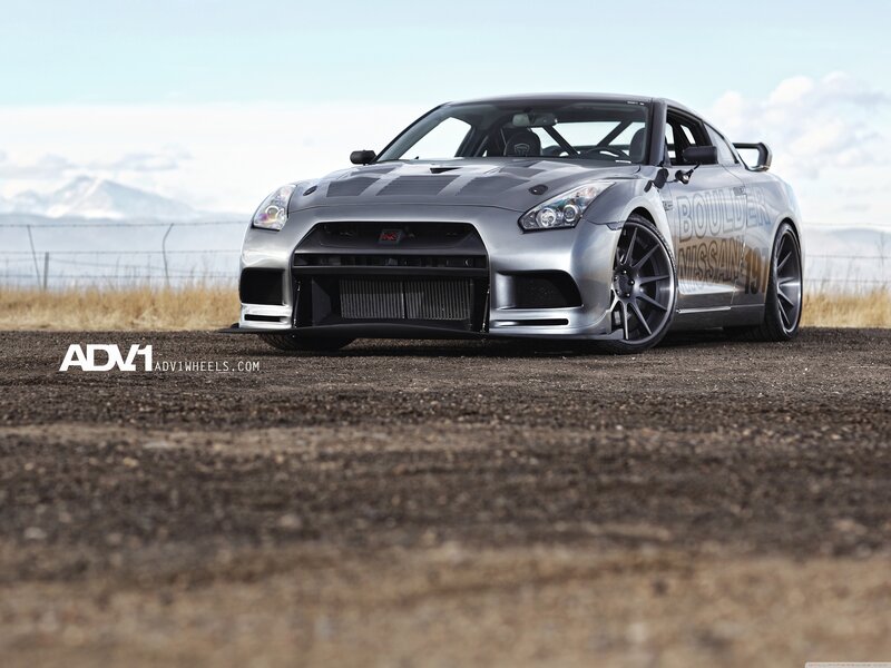 Silver Nissan GT-R on dirt road