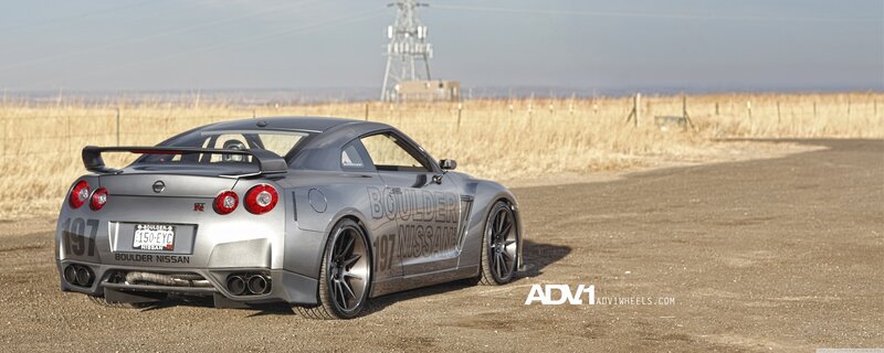 silver nissan gt-r on dirt road
