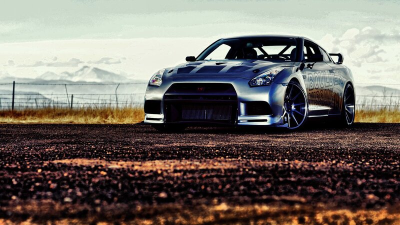 silver nissan gt-r on dirt road