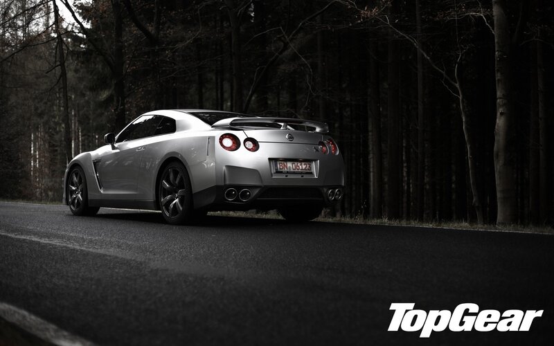 Silver Nissan GT-R on forest road