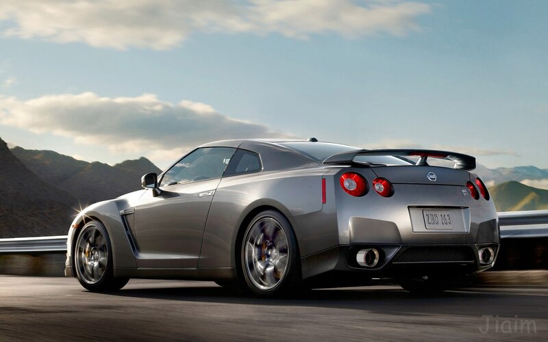 silver nissan gt-r on mountain road