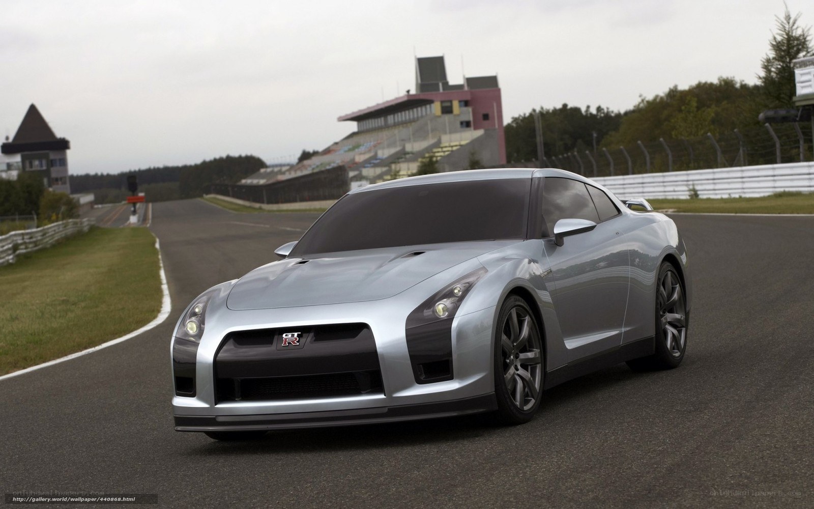 Silver Nissan GT-R on racetrack
