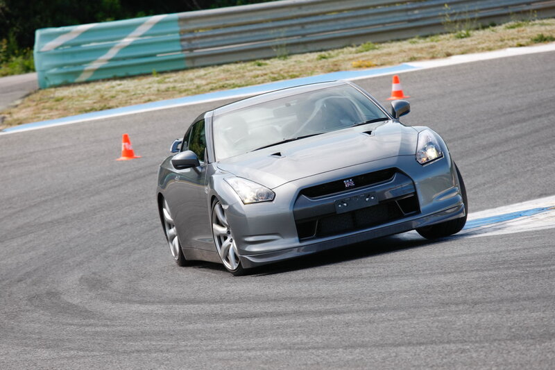 Silver Nissan GT-R on racetrack