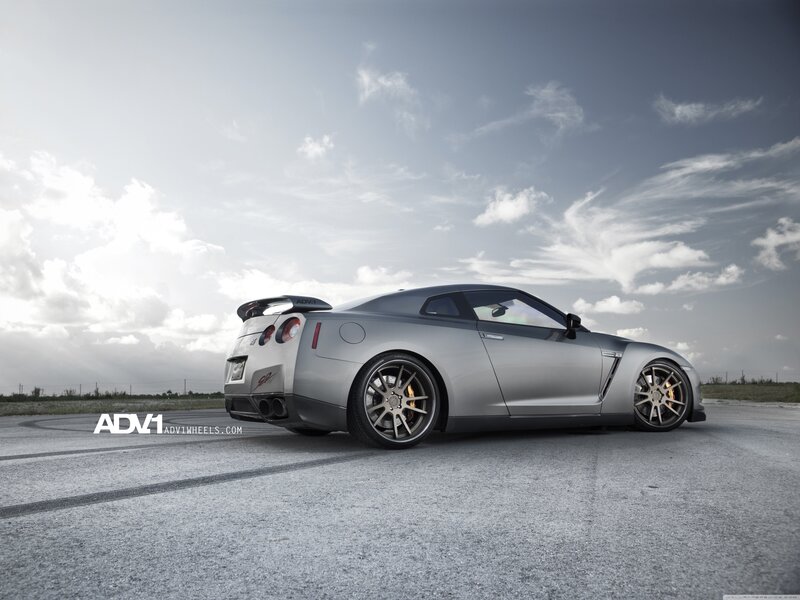 Silver Nissan GT-R on track