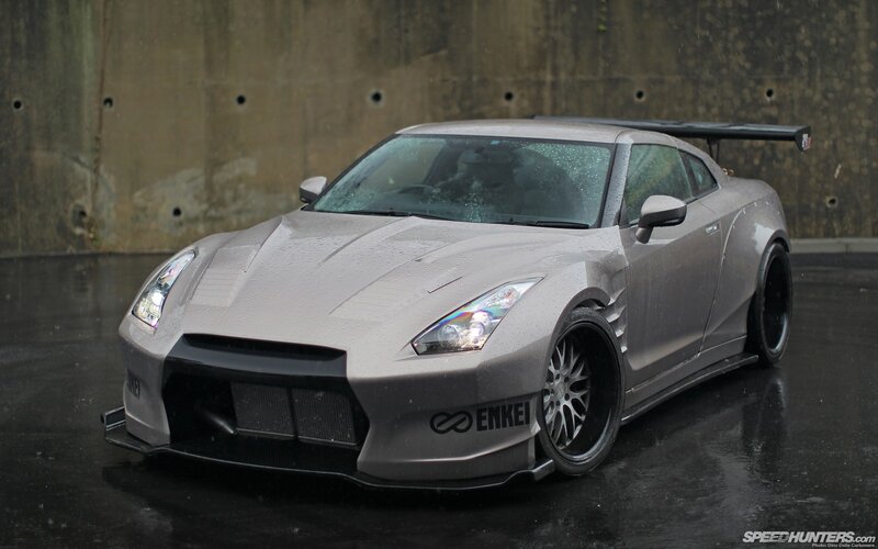 silver nissan gt-r on wet pavement