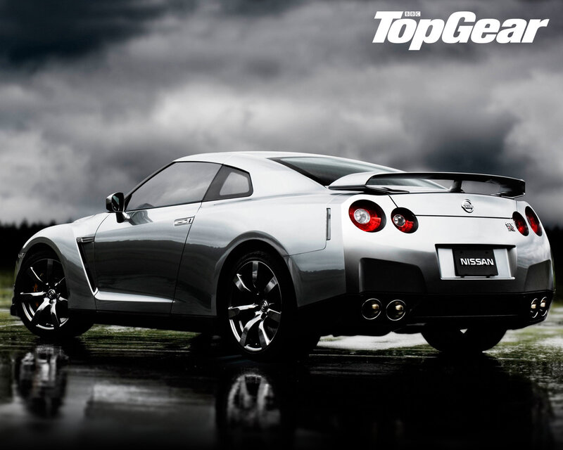 Silver Nissan GT-R on wet road