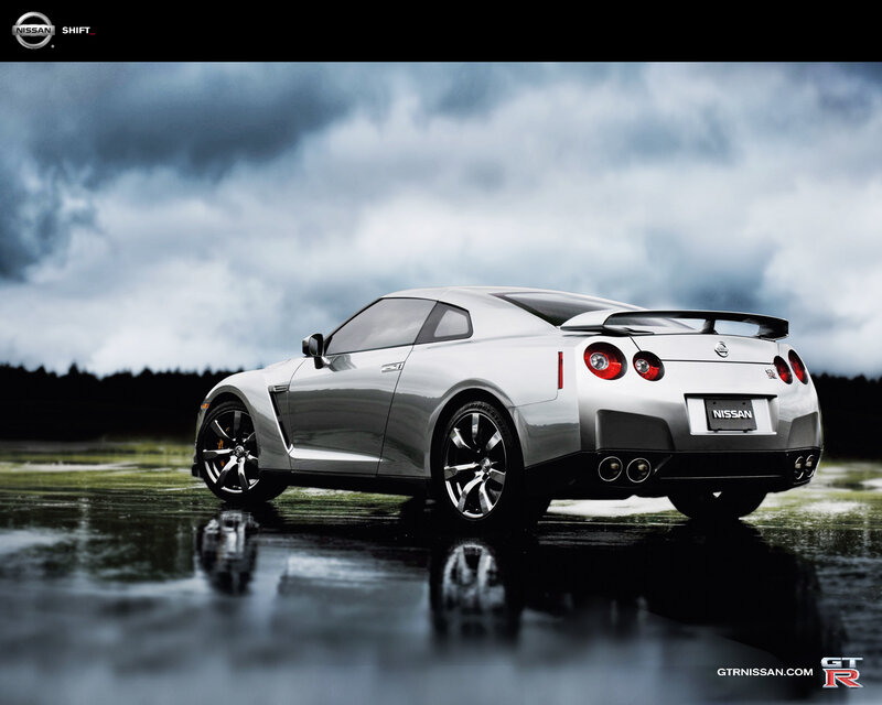 Silver Nissan GT-R on wet road