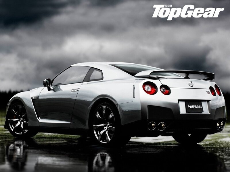 Silver Nissan GT-R on wet road