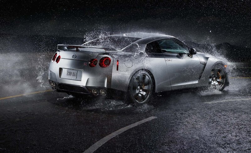 Silver Nissan GT-R on wet road
