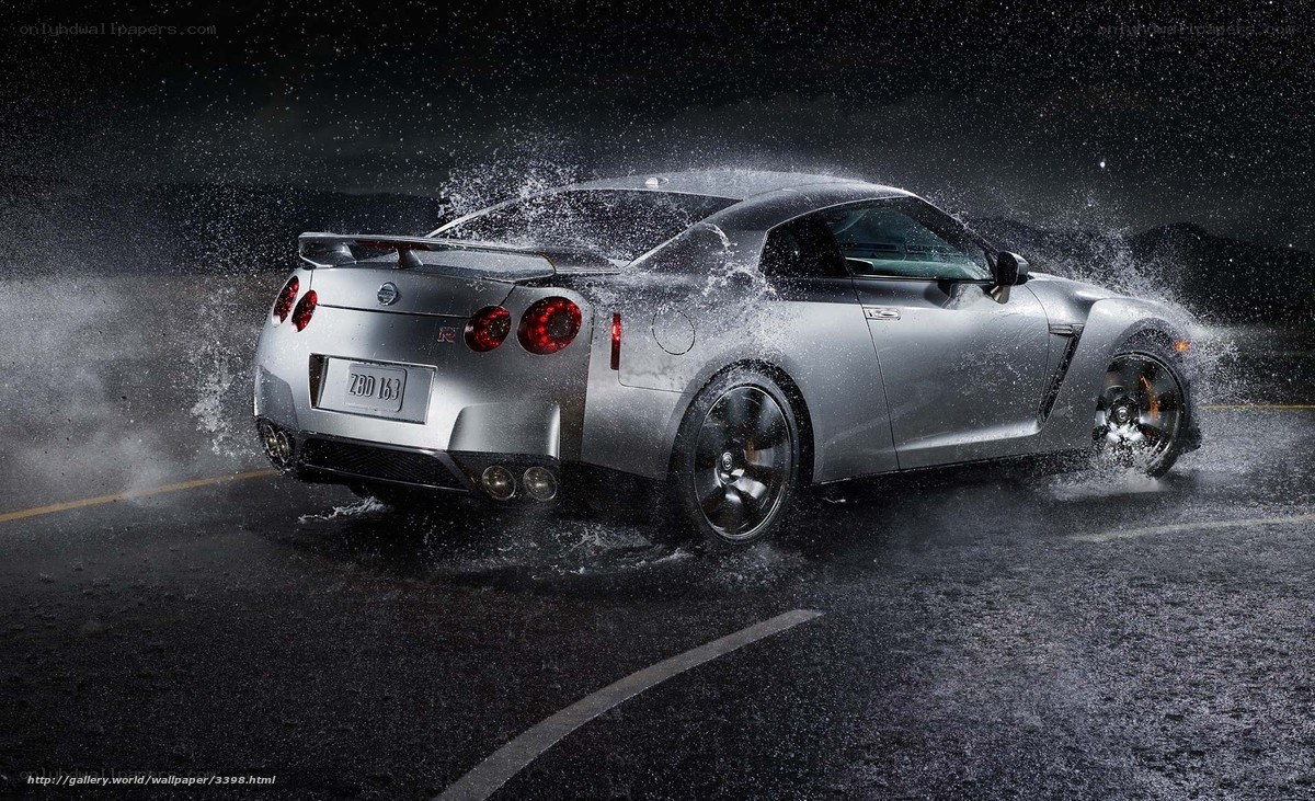 Silver Nissan GT-R on wet road