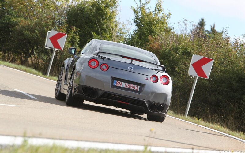 silver nissan gt-r on winding road