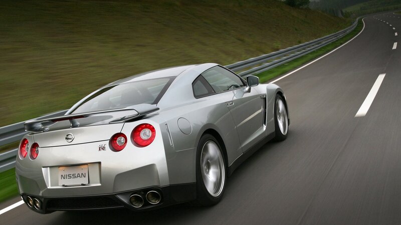 silver nissan gt-r on winding road