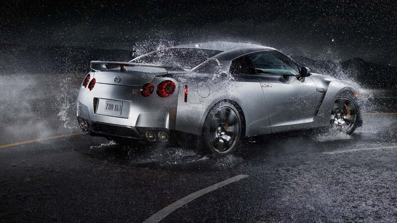 Silver Nissan GT-R splashing water