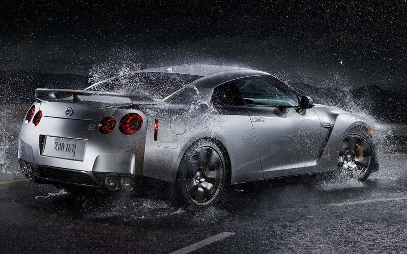 Silver Nissan GT-R splashing water