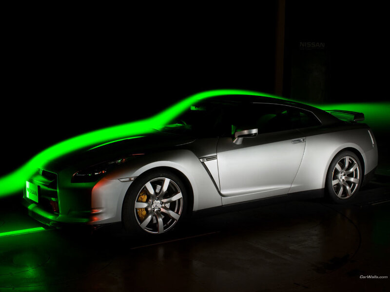 Silver Nissan GT-R with green light