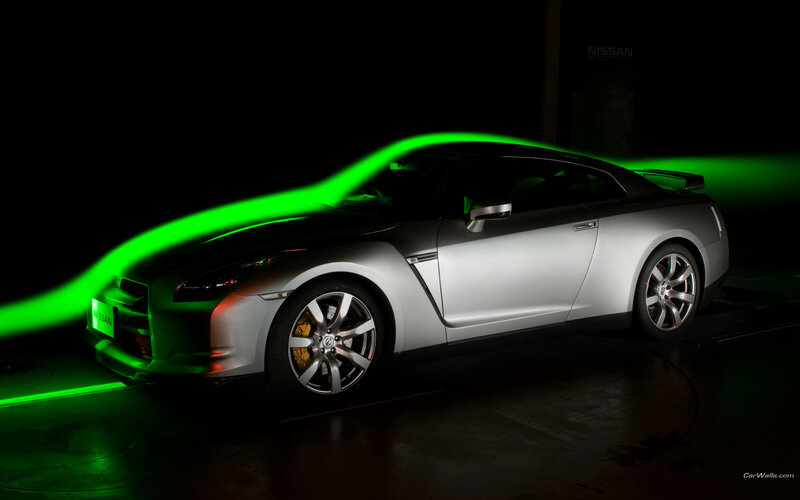 Silver Nissan GT-R with green light
