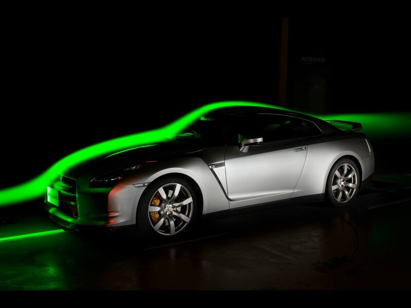 Silver Nissan GT-R with green light